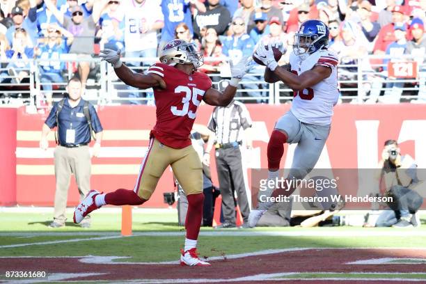 Evan Engram of the New York Giants catches a nine-yard touchdown against the San Francisco 49ers during their NFL game at Levi's Stadium on November...