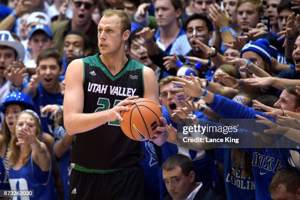 Cameron Crazies and fans of the Duke Blue Devils taunt Isaac Neilson of the Utah Valley Wolverines at Cameron Indoor Stadium on November 11, 2017 in...