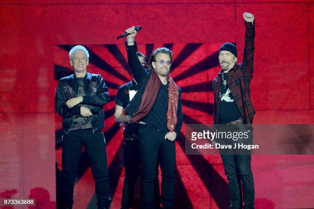 Irish rock band U2, Bono , The Edge , Adam Clayton and Larry Mullen Jr , accept the global icon award on stage during the MTV EMAs 2017 held at The...