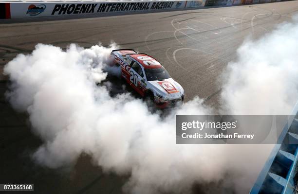 Matt Kenseth, driver of the Circle K Toyota, celebrates with a burnout after winning the Monster Energy NASCAR Cup Series Can-Am 500 at Phoenix...