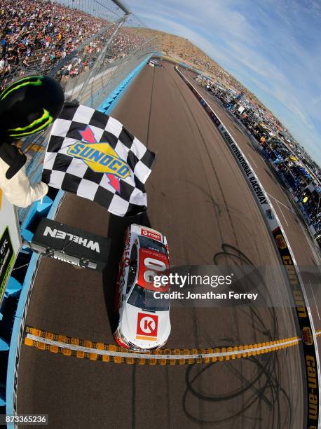 Matt Kenseth, driver of the Circle K Toyota, crosses the finish line to win the Monster Energy NASCAR Cup Series Can-Am 500 at Phoenix International...