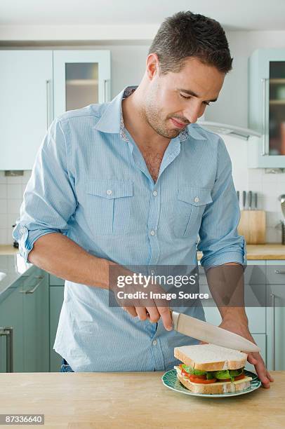 man making sandwich - making a sandwich stock pictures, royalty-free photos & images