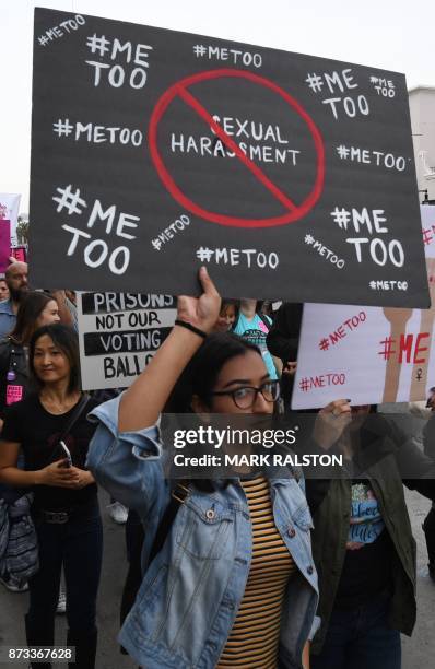 Victims of sexual harassment, sexual assault, sexual abuse and their supporters protest during a #MeToo march in Hollywood, California on November...