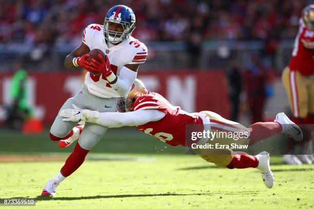 Shane Vereen of the New York Giants is tackled by Reuben Foster of the San Francisco 49ers during their NFL game at Levi's Stadium on November 12,...