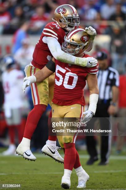 Brock Coyle and Reuben Foster of the San Francisco 49ers react after a play against the New York Giants during their NFL game at Levi's Stadium on...