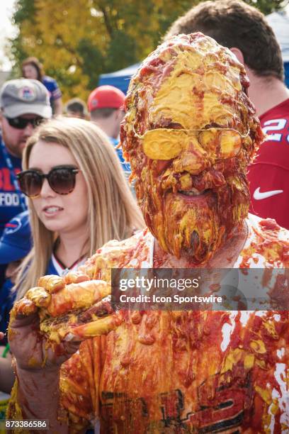 The ketchup and mustard shower while tailgating at the Hammer's Lot at the Pinto Ron tailgate party before the Buffalo Bills faced the Tampa Bay...