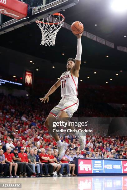 Ira Lee of the Arizona Wildcats attempts a dunk during the second half of the college basketball game against the UMBC Retrievers at McKale Center on...