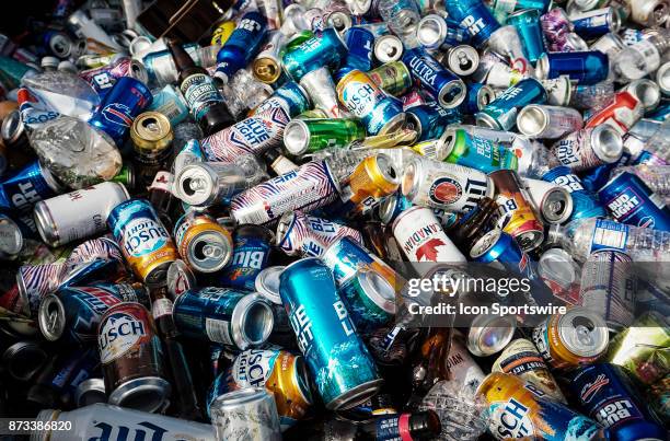 Hundreds of empty beer cans in the bed of a pickup truck as Buffalo Bills fans tailgate at the Hammer's Lot at the Pinto Ron tailgate party before...