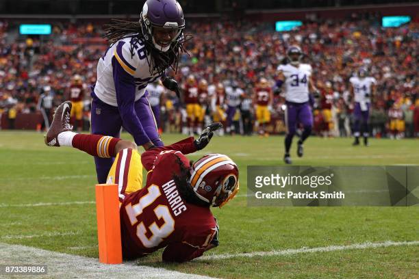 Wide receiver Maurice Harris of the Washington Redskins catches a touchdown pass in front of cornerback Trae Waynes of the Minnesota Vikings during...