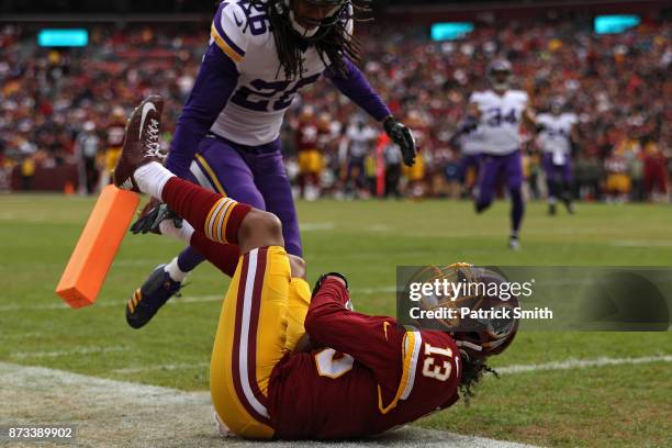 Wide receiver Maurice Harris of the Washington Redskins catches a touchdown pass in front of cornerback Trae Waynes of the Minnesota Vikings during...