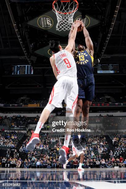 Zhou Qi of the Houston Rockets blocks the shot against Ike Anigbogu of the Indiana Pacers on November 12, 2017 at Bankers Life Fieldhouse in...