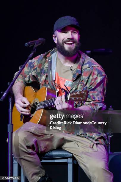 In this handout photo provided by The Country Rising Fund of The Community Foundation of Middle Tennessee, singer Sam Hunt performs onstage for the...