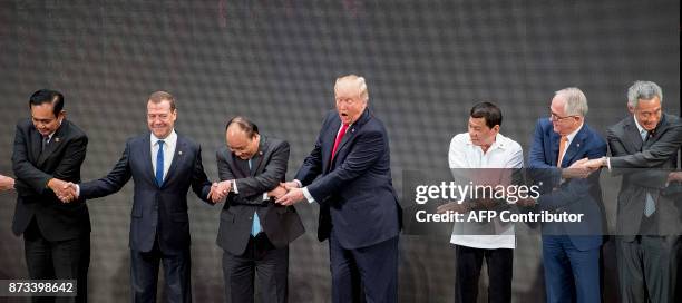 Thailand's Prime Minister Prayut Chan-O-Cha, Russian Prime Minister Dmitry Medvedev, Vietnam's Prime Minister Nguyen Xuan Phuc, US President Donald...