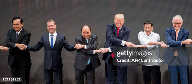 Thailand's Prime Minister Prayut Chan-O-Cha, Russian Prime Minister Dmitry Medvedev, Vietnam's Prime Minister Nguyen Xuan Phuc, US President Donald...