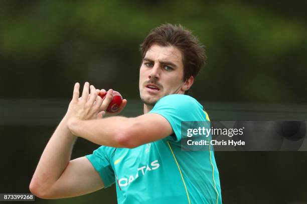 Pat Cummins bowls during day an Australian cricket training session at Allan Border Field on November 13, 2017 in Brisbane, Australia.