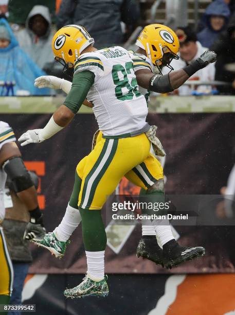 Richard Rodgers and Ty Montgomery of the Green Bay Packers celebrate a touchdown run by Mongomery against the Chicago Bears at Soldier Field on...