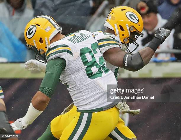 Richard Rodgers and Ty Montgomery of the Green Bay Packers celebrate a touchdown run by Mongomery against the Chicago Bears at Soldier Field on...