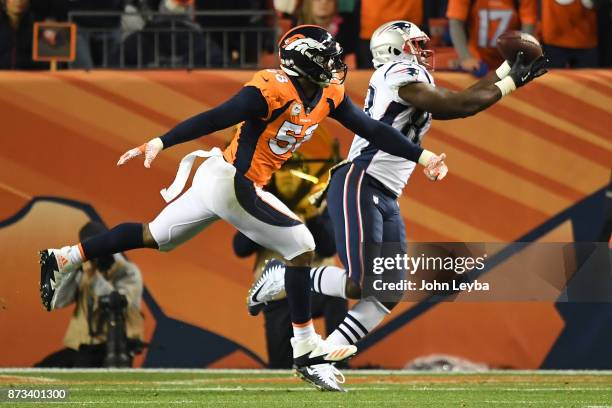 Dwayne Allen of the New England Patriots catches a touchdown pass over Von Miller of the Denver Broncos in the second quarter. The Denver Broncos...