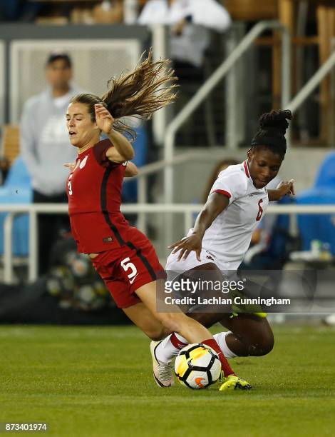 Kelley O'Hara of the United States is tackled by Deanne Rose of Canada during a friendly match at Avaya Stadium on November 12, 2017 in San Jose,...