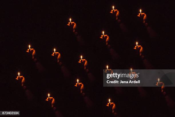 hands holding lighters during concert - lighter shows stock pictures, royalty-free photos & images