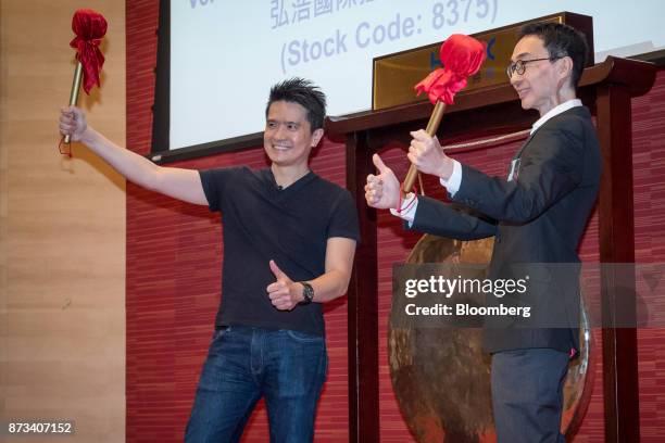 Billionaire Tan Min-Liang, chief executive officer and co-founder of Razer Inc., left, and Lim Kaling, non-executive director, pose for photographs...