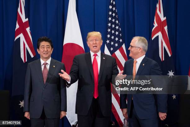 Japan's Prime Minister Shinzo Abe , US President Donald Trump and Australia Prime Minister Malcolm Turnbull attend a trilateral meeeting during the...