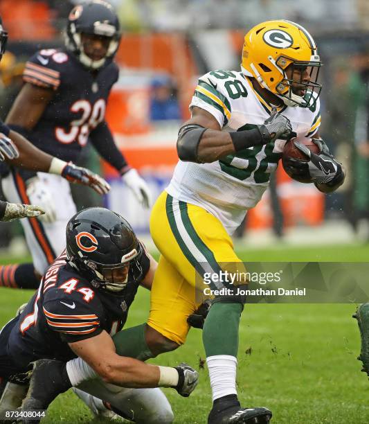 Ty Montgomery of the Green Bay Packers is tackled by Nick Kwiatkoski of the Chicago Bears at Soldier Field on November 12, 2017 in Chicago, Illinois.