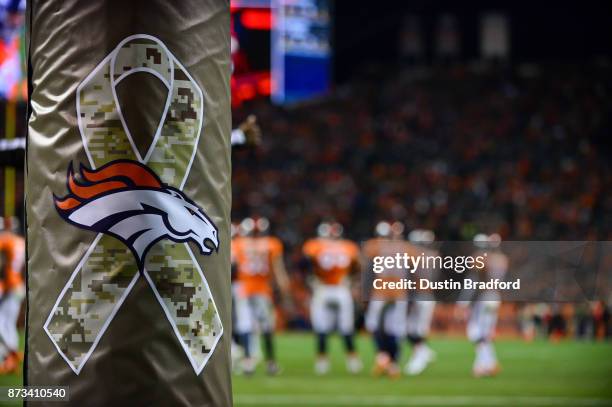 In-stadium tributes to the NFL's salute to service included special padding on the field goal uprights as seen during a game between the Denver...