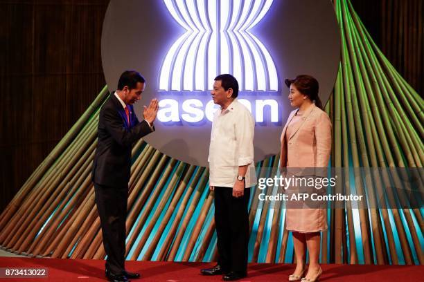 Indonesia's President Joko Widodo gestures to Philippine President Rodrigo Duterte before the opening ceremony of the 31st Association of Southeast...