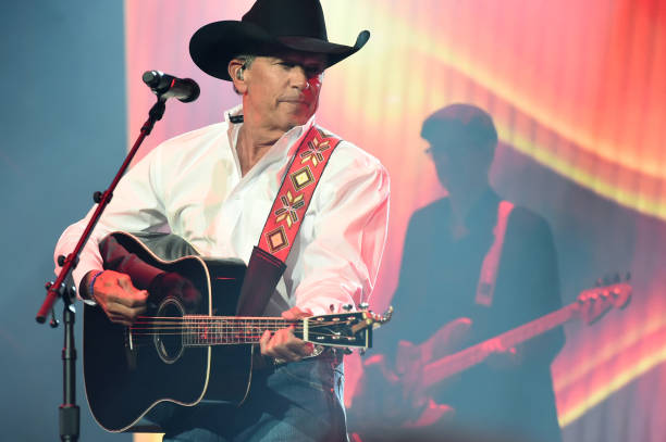 In this handout photo provided by The Country Rising Fund of The Community Foundation of Middle Tennessee, singer-songwriter George Strait performs...