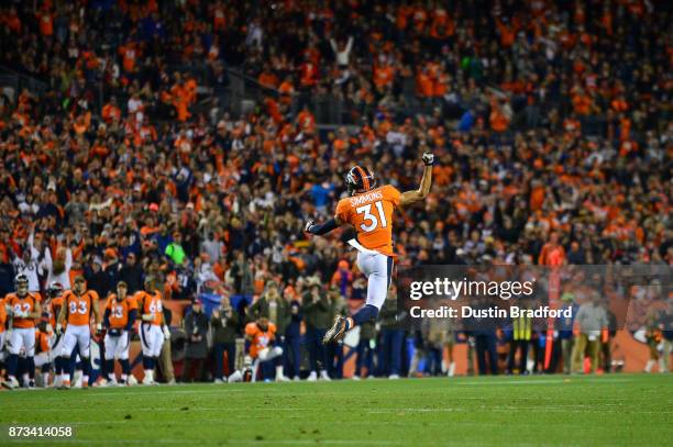 Strong safety Justin Simmons of the Denver Broncos celebrates after a sack on third down against the New England Patriots at Sports Authority Field...