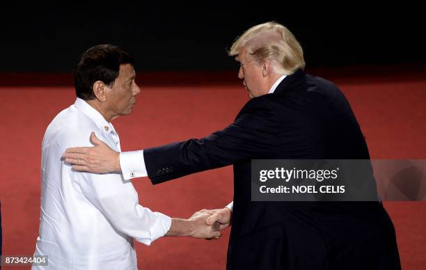 Philippine President Rodrigo Duterte shakes hands with US President Donald Trump during the 31st Association of Southeast Asian Nations Summit in...