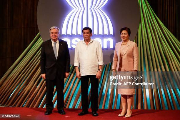 United Nations Secretary-General Antonio Guterres, Philippine President Rodrigo Duterte and his partner Cielito Avanceno pose for photos before the...