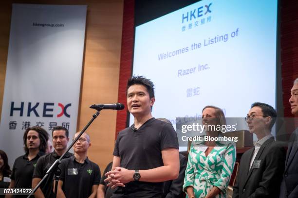 Billionaire Tan Min-Liang, chief executive officer and co-founder of Razer Inc., center, speaks during the company's listing ceremony at the Hong...