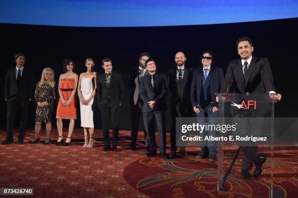 Greg Sestero, Jacki Weaver, Alison Brie, Ari Graynor, Dave Franco, Seth Rogen, Josh Hutcherson, Paul Scheer, and Tommy Wiseau listen to James Franco...