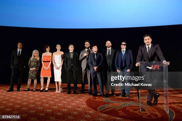 Greg Sestero, Jacki Weaver, Alison Brie, Ari Graynor, Dave Franco, Seth Rogen, Josh Hutcherson, Paul Scheer, and Tommy Wiseau listen to James Franco...