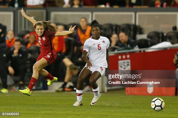 Kelley O'Hara of the United States competes against Deanne Rose of Canada at Avaya Stadium on November 12, 2017 in San Jose, California.