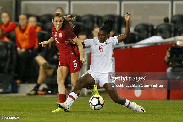 Kelley O'Hara of the United States competes against Deanne Rose of Canada at Avaya Stadium on November 12, 2017 in San Jose, California.