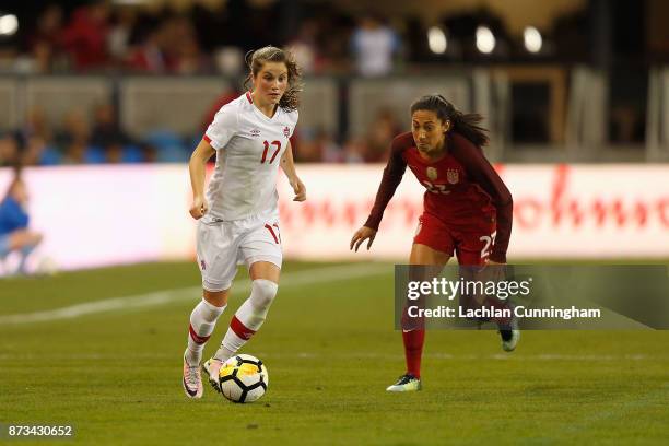 Jessie Fleming of Canada evades Christen Press of the United States during a friendly match at Avaya Stadium on November 12, 2017 in San Jose,...