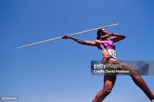athletics, javelin thrower in action, low angle view - jabalina fotografías e imágenes de stock