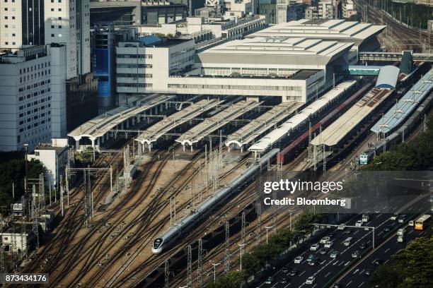 Train exits the Guangzhou East Railway Station in Guangzhou, China, on Monday, Oct. 30, 2017. China is poised for an acceleration of deals as...