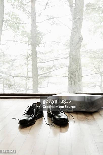 shoes and a briefcase on a wooden floor - small group of objects stock pictures, royalty-free photos & images