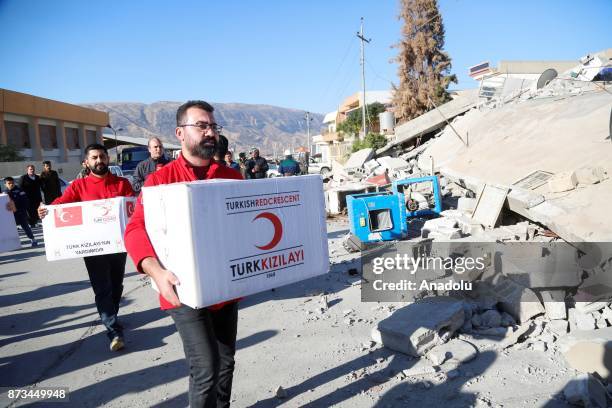 Members of the Turkish Red Crescent, who reached the region as a first response, dispatch aid goods and food to the survivors of the earthquake in...