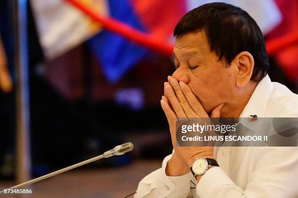 Philippine President Rodrigo Duterte gestures during the 20th ASEAN China Summit on the sideline of the 31st Association of Southeast Asian Nations...