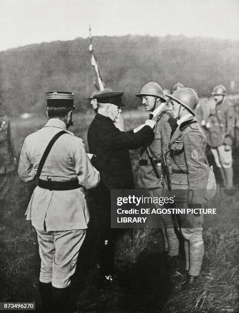 French President Raymond Poincare handing over the war cross to the officers of an assault battalion, France, World War I, from l'Illustrazione...