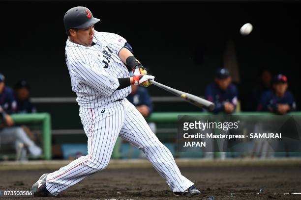 Hotaka Yamakawa of Samurai Japan swings at a pitch during a practice game between Japan and Saitama Seibu Lions at Sokken Stadium on November 13,...
