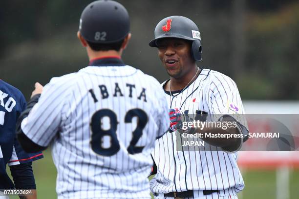 Louis Okoye of Samurai Japan hits a single during a practice game between Japan and Saitama Seibu Lions at Sokken Stadium on November 13, 2017 in...