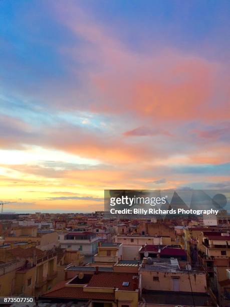 skyline and roof tops of corato, puglia, italy at sunset - ancorato stock pictures, royalty-free photos & images