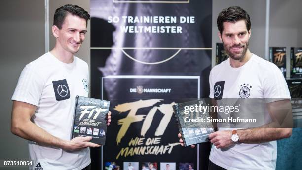 Nicklas Dietrich and Yann-Benjamin Kugel , fitness coaches of Germany, pose during the 'Fit wie die Mannschaft' Book Presentation at Hyatt Hotel on...