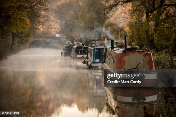 Mist rises from the Kennet and Avon canal near Limpley Stoke as the sun rises on November 13, 2017 near Bath, England. After a warm autumn, with...